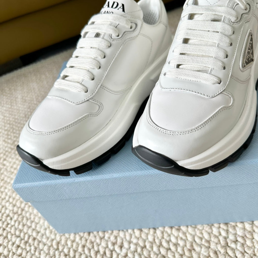 PRADA THICK SOLE SNEAKER WHITE AND BLACK LOGO CALFSKIN