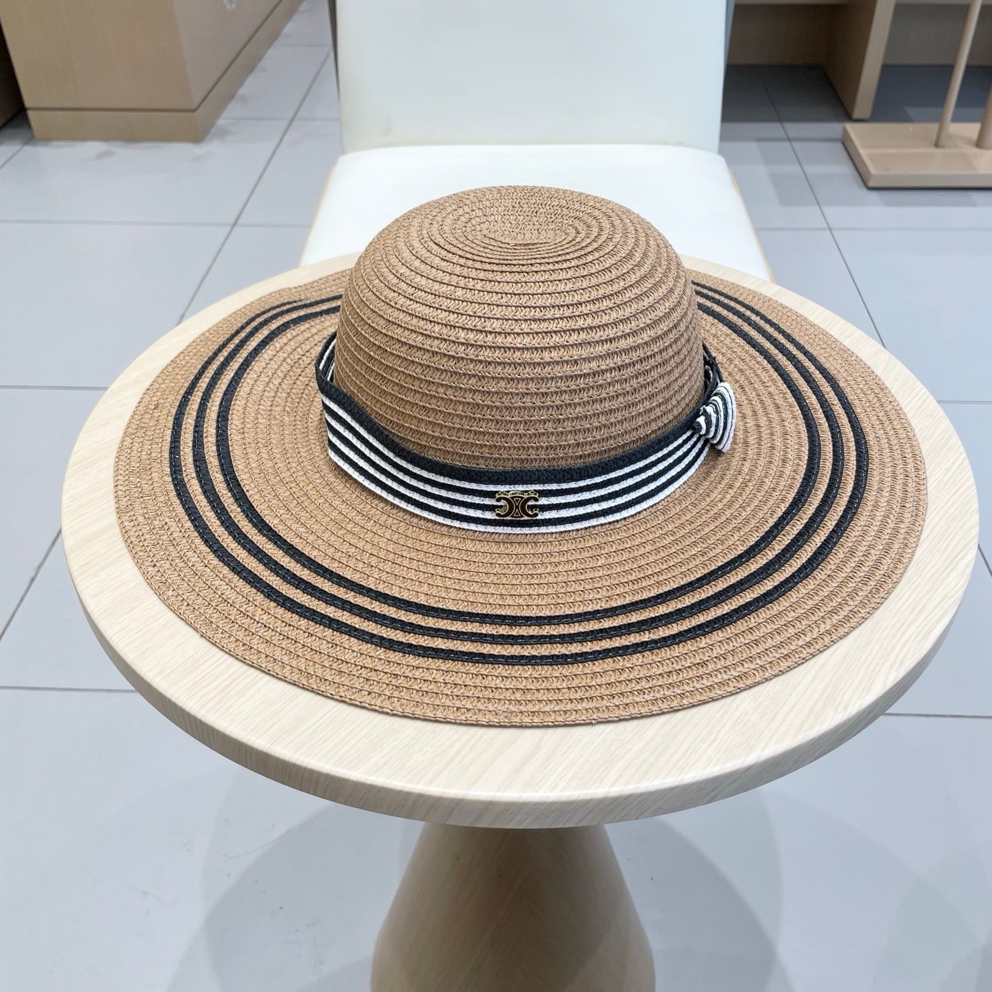 CELINE WIDE BRIM HAT MODEL 650410 IN BROWN WITH BLACK STRIPES WOVEN STRAW