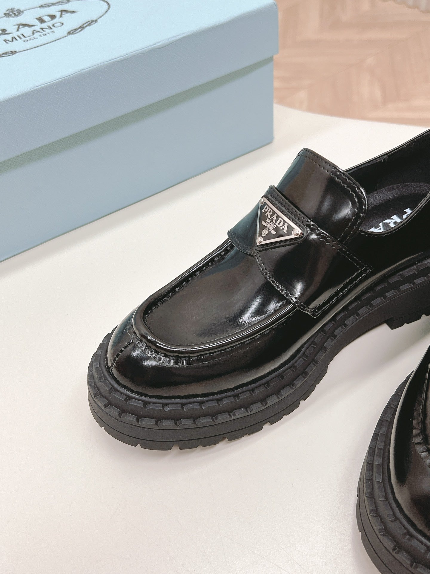 PRADA BRUSHED MONOLITH LOAFERS GLOSSY BLACK CALFSKIN
