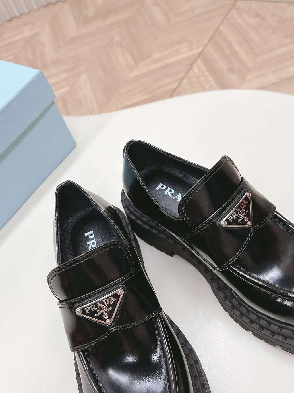 PRADA BRUSHED MONOLITH LOAFERS GLOSSY BLACK CALFSKIN