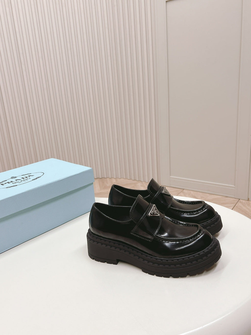 PRADA BRUSHED MONOLITH LOAFERS GLOSSY BLACK CALFSKIN