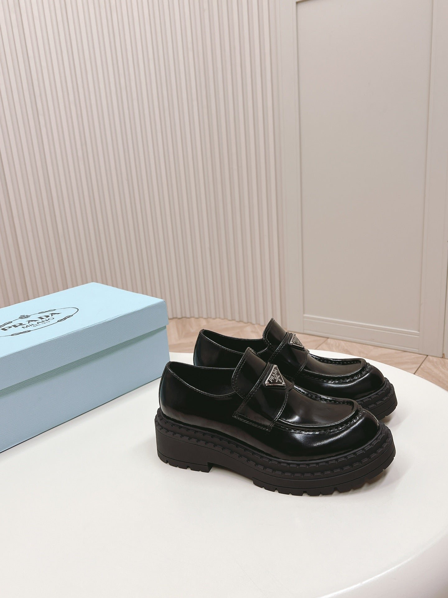 PRADA BRUSHED MONOLITH LOAFERS GLOSSY BLACK CALFSKIN