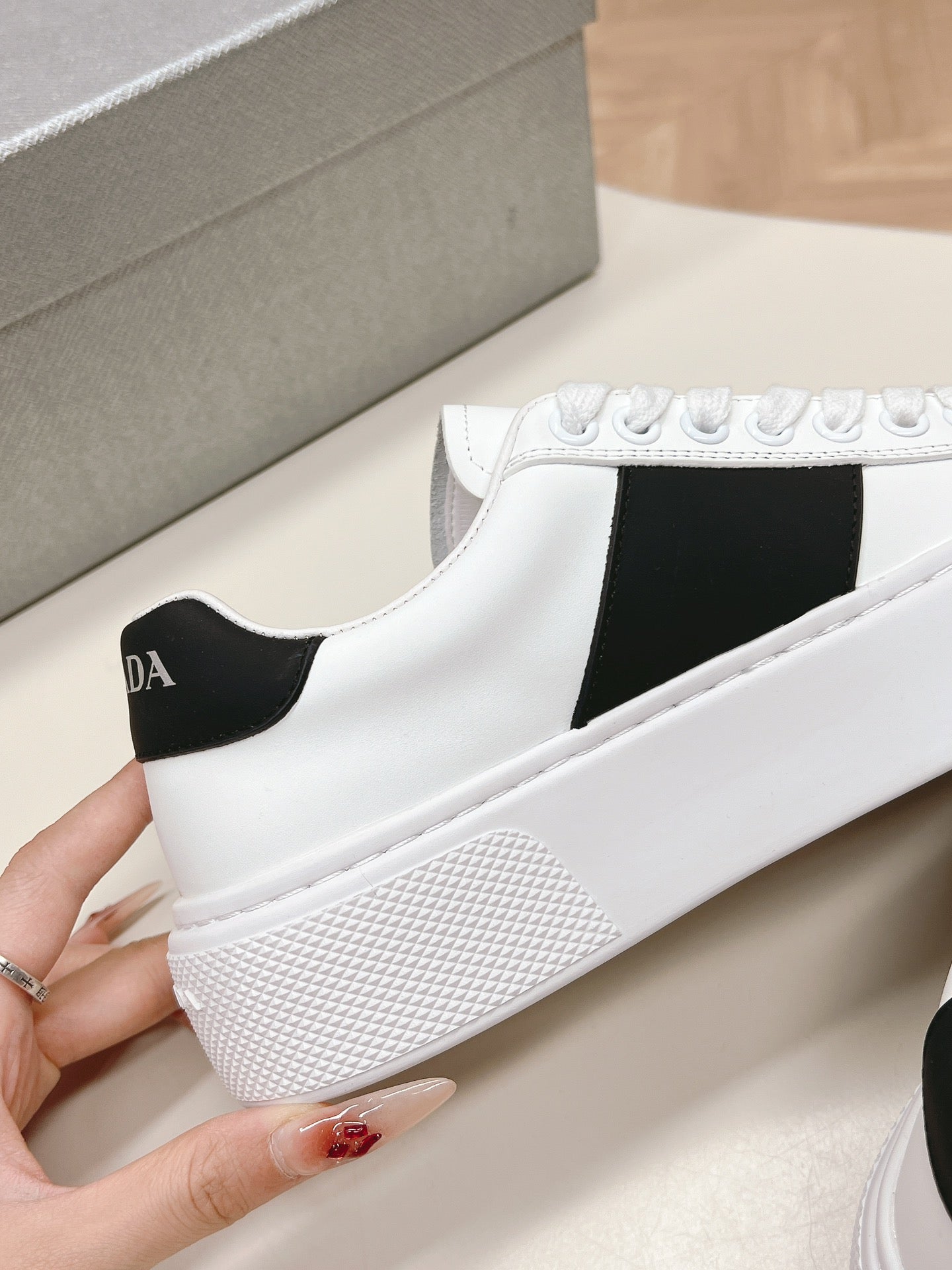 PRADA LEATHER LOGO OUTLET SNEAKERS BLACK AND WHITE CALFSKIN