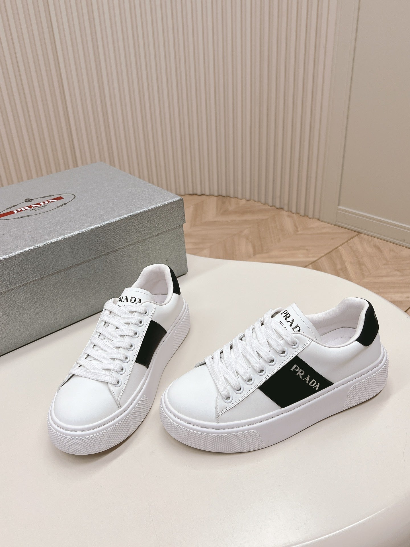 PRADA LEATHER LOGO OUTLET SNEAKERS BLACK AND WHITE CALFSKIN