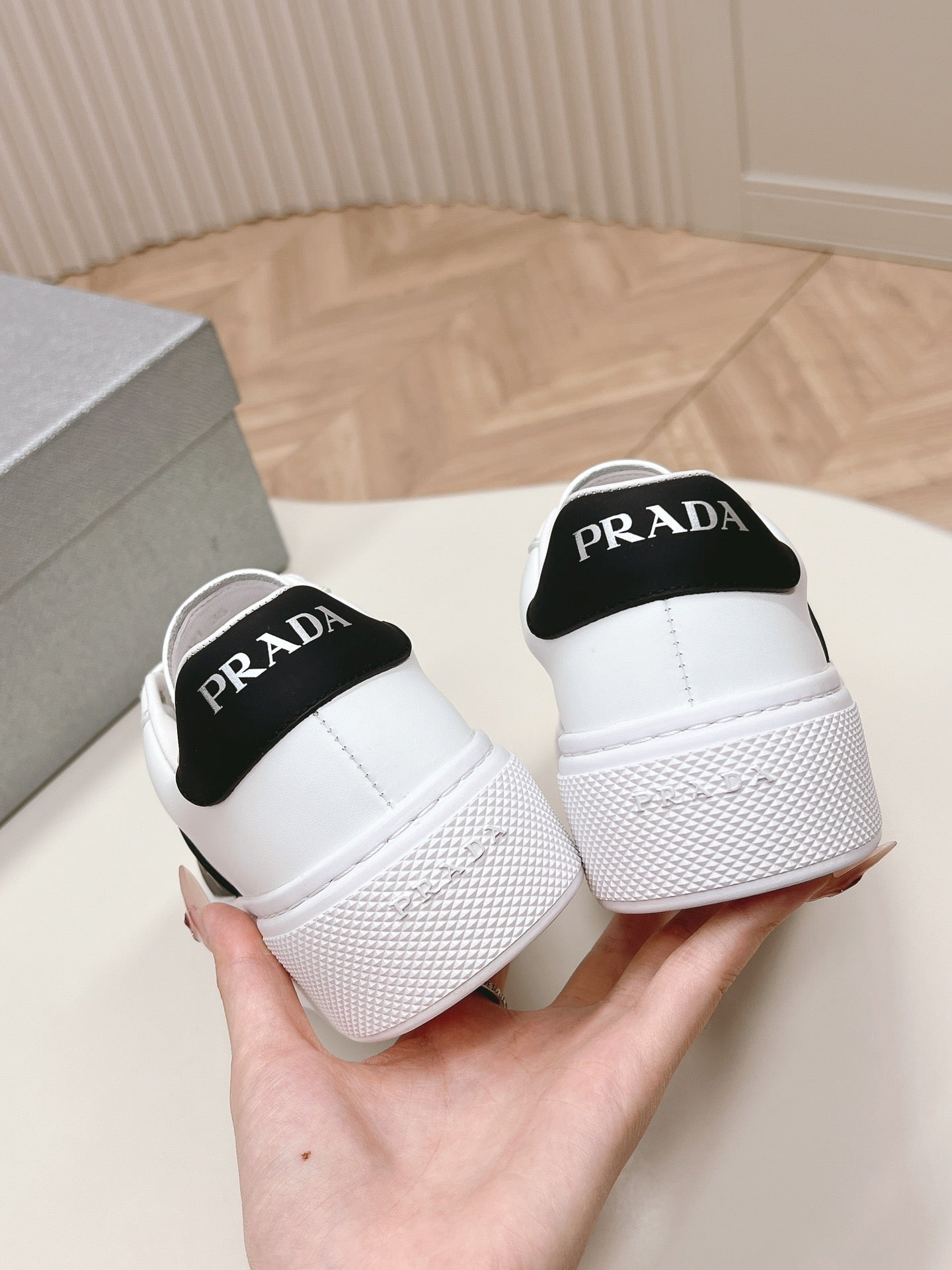 PRADA LEATHER LOGO OUTLET SNEAKERS BLACK AND WHITE CALFSKIN