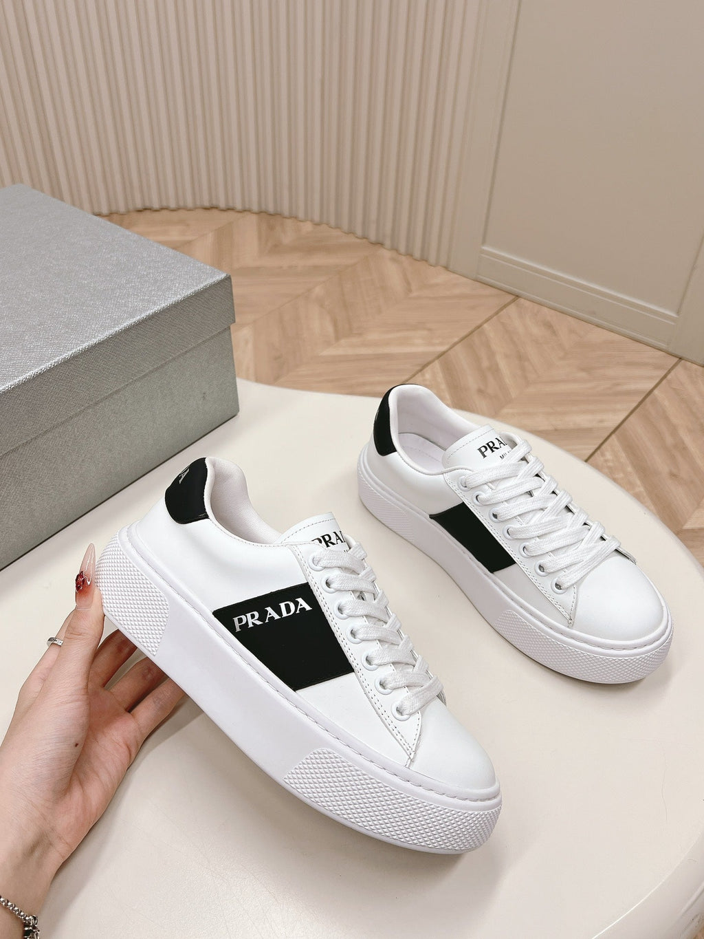 PRADA LEATHER LOGO OUTLET SNEAKERS BLACK AND WHITE CALFSKIN