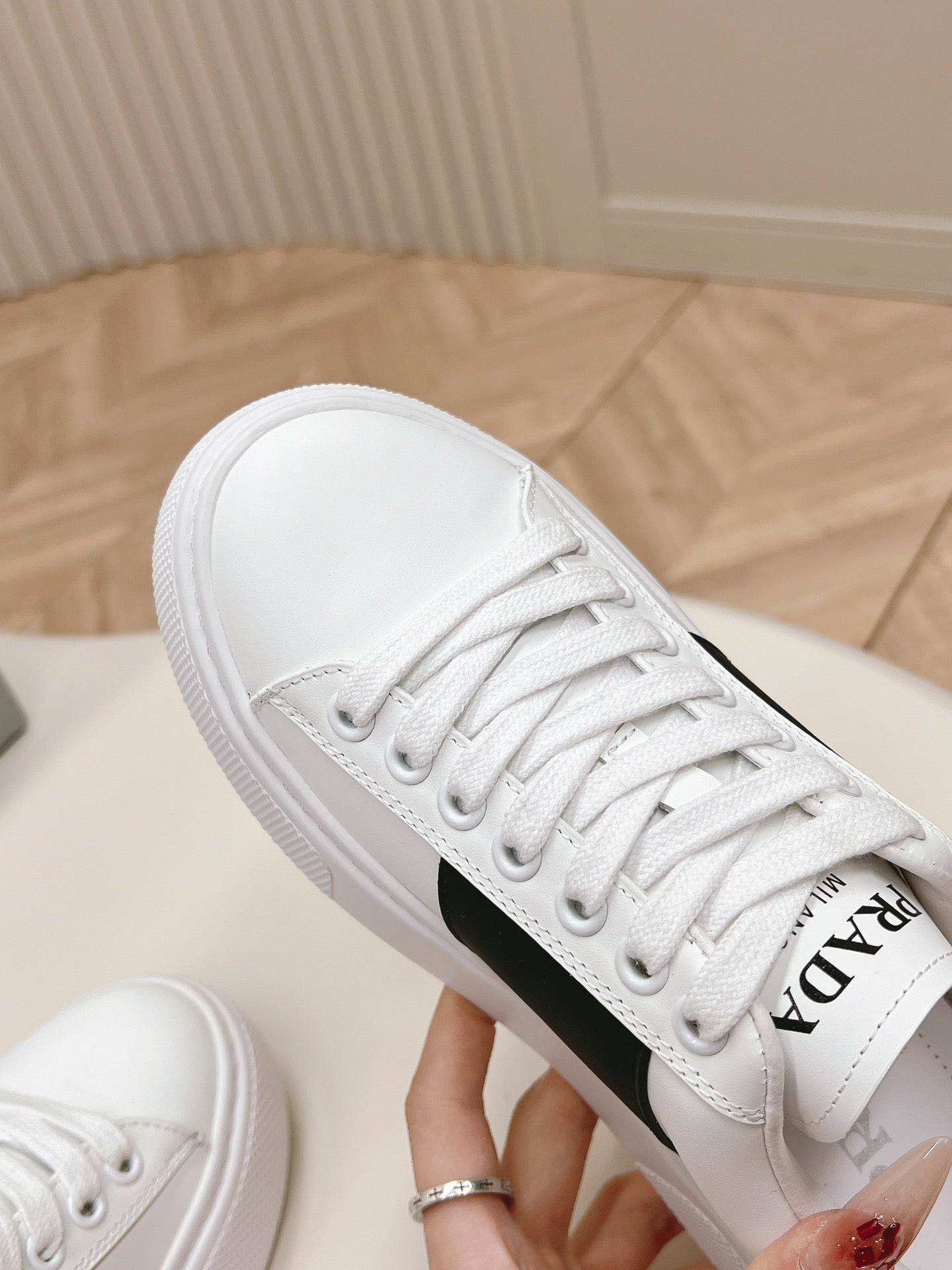 PRADA LEATHER LOGO OUTLET SNEAKERS BLACK AND WHITE CALFSKIN
