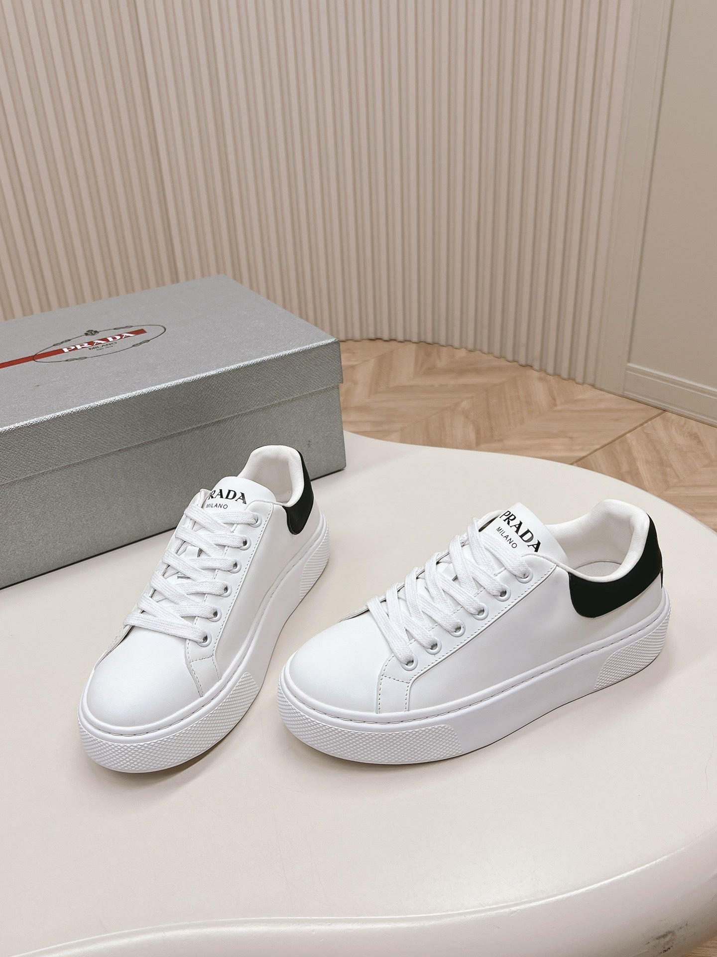 PRADA RETRO SNEAKERS WHITE AND BLACK CALFSKIN
