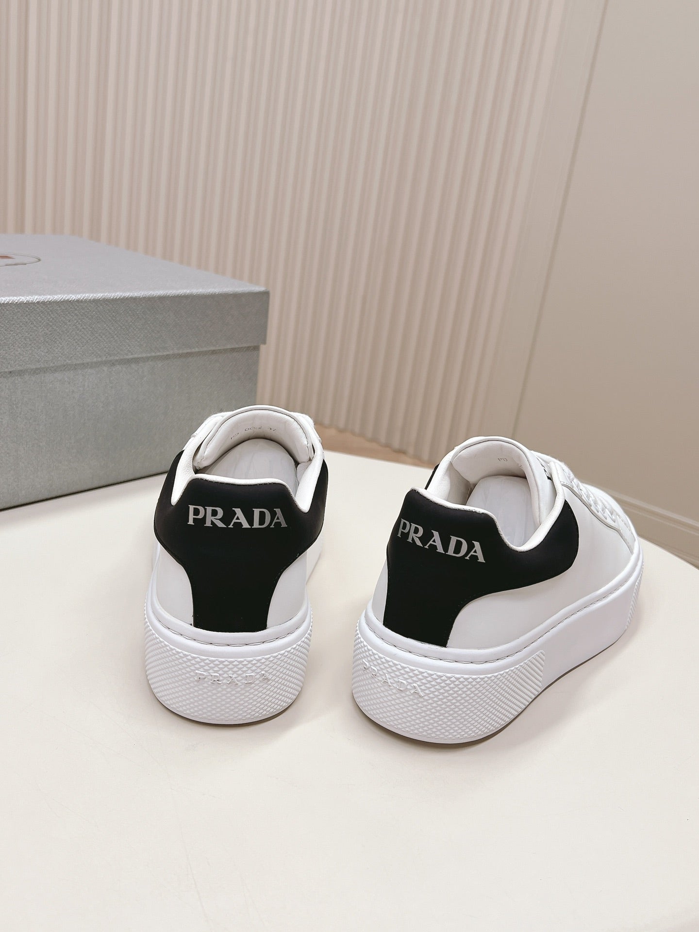 PRADA RETRO SNEAKERS WHITE AND BLACK CALFSKIN