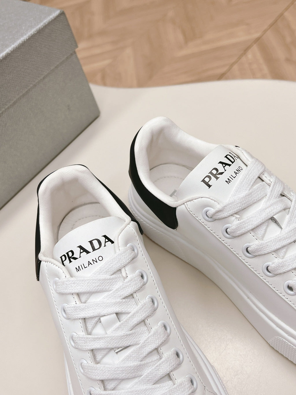 PRADA RETRO SNEAKERS WHITE AND BLACK CALFSKIN
