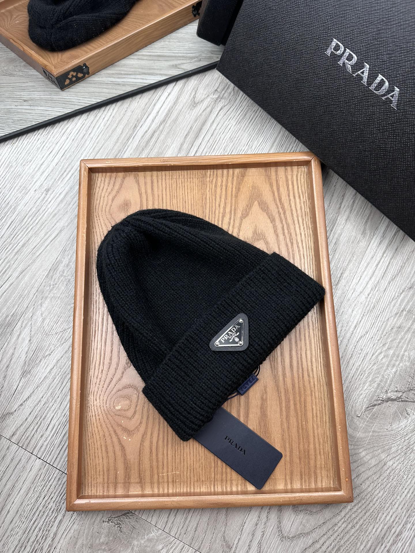 PRADA BEANIE HAT IN BLACK WOOL 332393