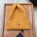 PRADA BEANIE HAT IN MUSTARD YELLOW WOOL 332397