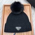 PRADA BEANIE HAT IN BLACK WOOL 352368