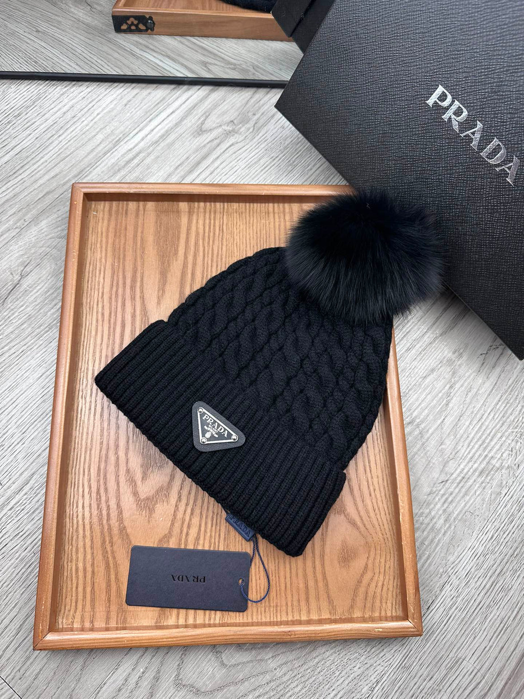 PRADA BEANIE HAT IN BLACK WOOL 352375
