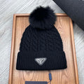 PRADA BEANIE HAT IN BLACK WOOL 352375