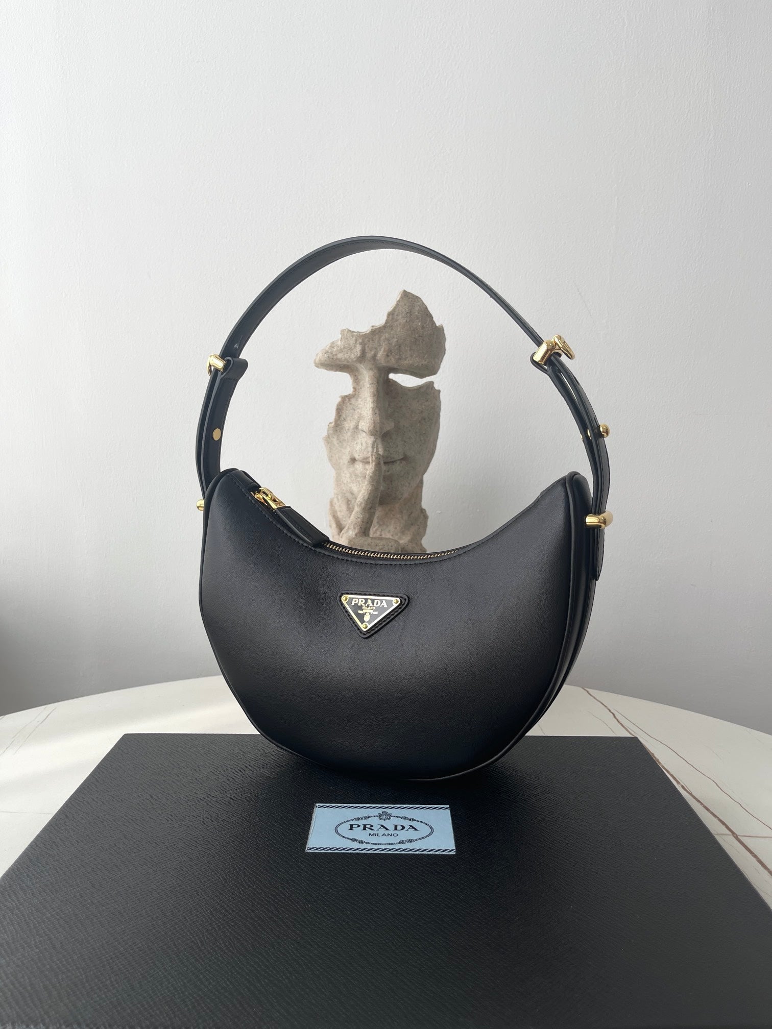 PRADA ARQUÉ 22 SHOULDER BAG IN BLACK LEATHER