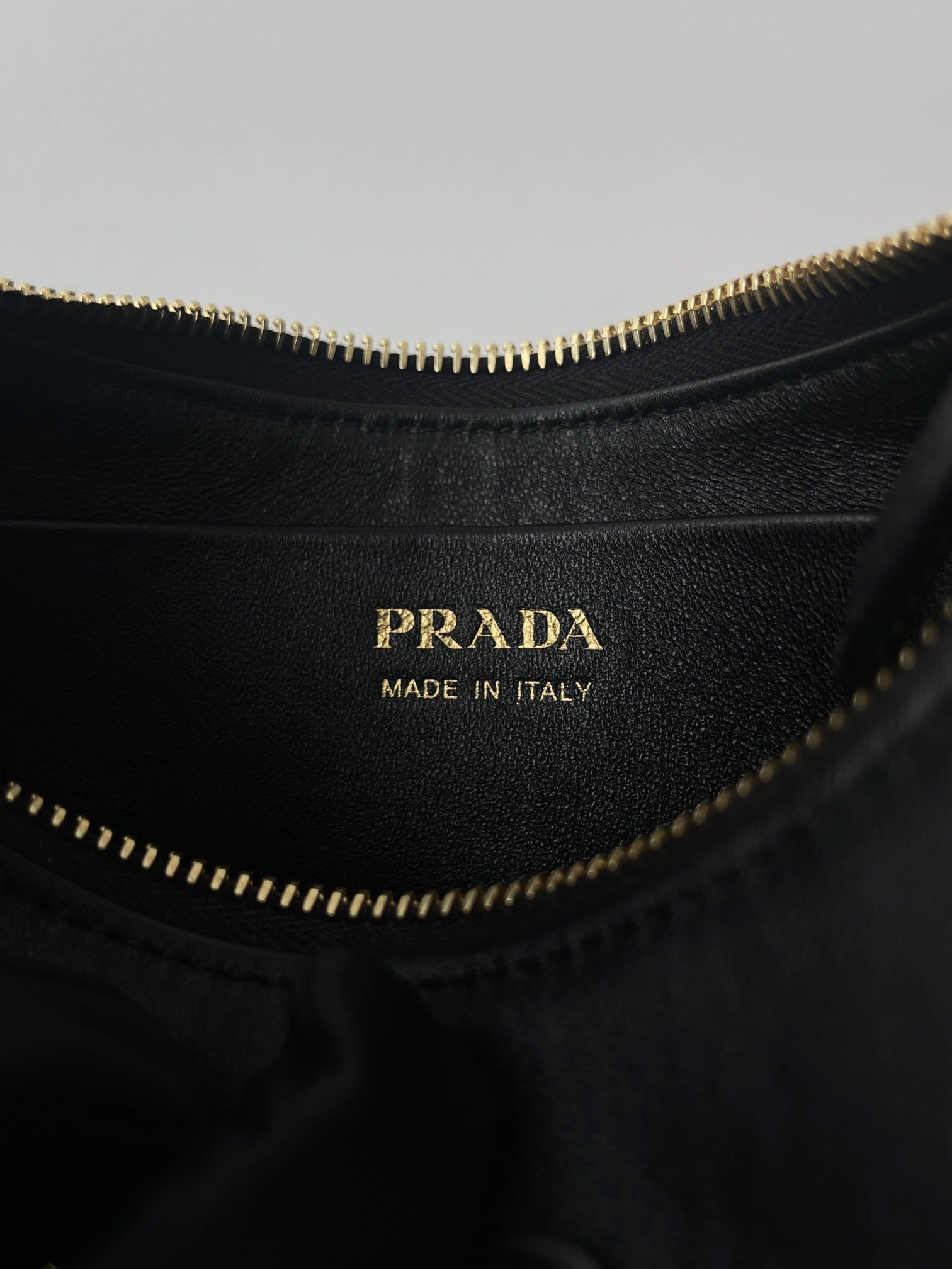 PRADA ARQUÉ 22 SHOULDER BAG IN BLACK LEATHER