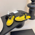 PRADA SNEAKER MULES IN YELLOW NYLON AND SUEDE