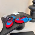 PRADA SNEAKER MULES IN BLUE NYLON AND RED SUEDE
