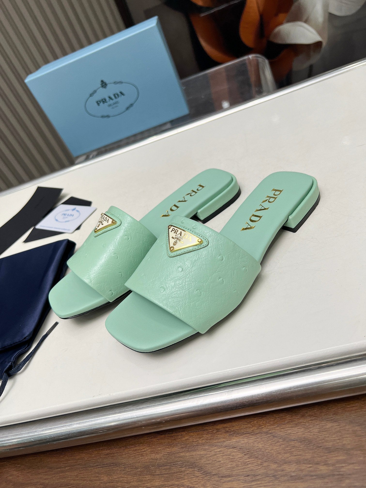 PRADA SAFFIANO PATENT SLIDES OSTRICH MOTIF SEAFOAM CALFSKIN