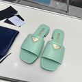 PRADA SAFFIANO PATENT SLIDES OSTRICH MOTIF SEAFOAM CALFSKIN