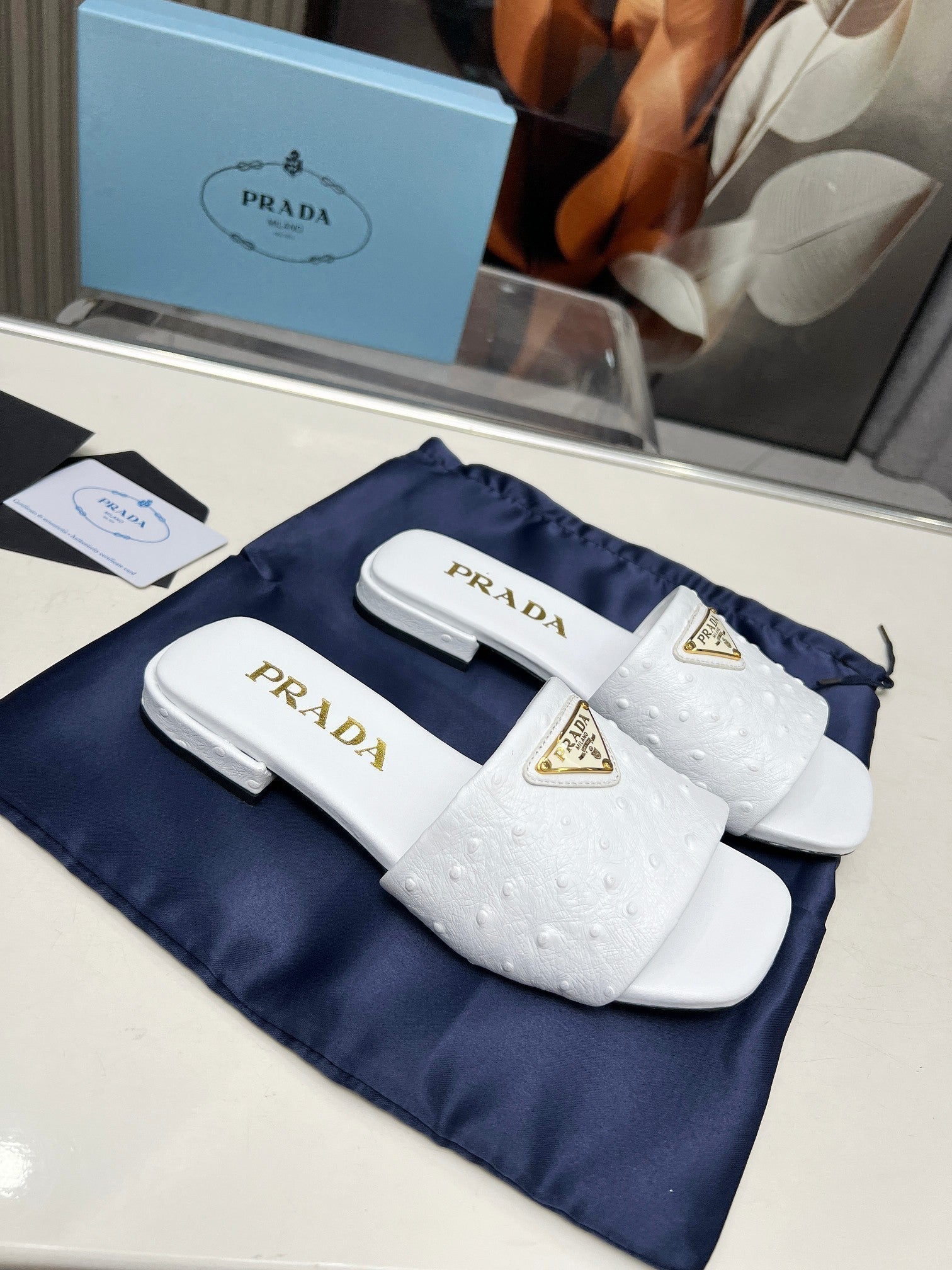 PRADA SAFFIANO PATENT SLIDES OSTRICH MOTIF WHITE CALFSKIN