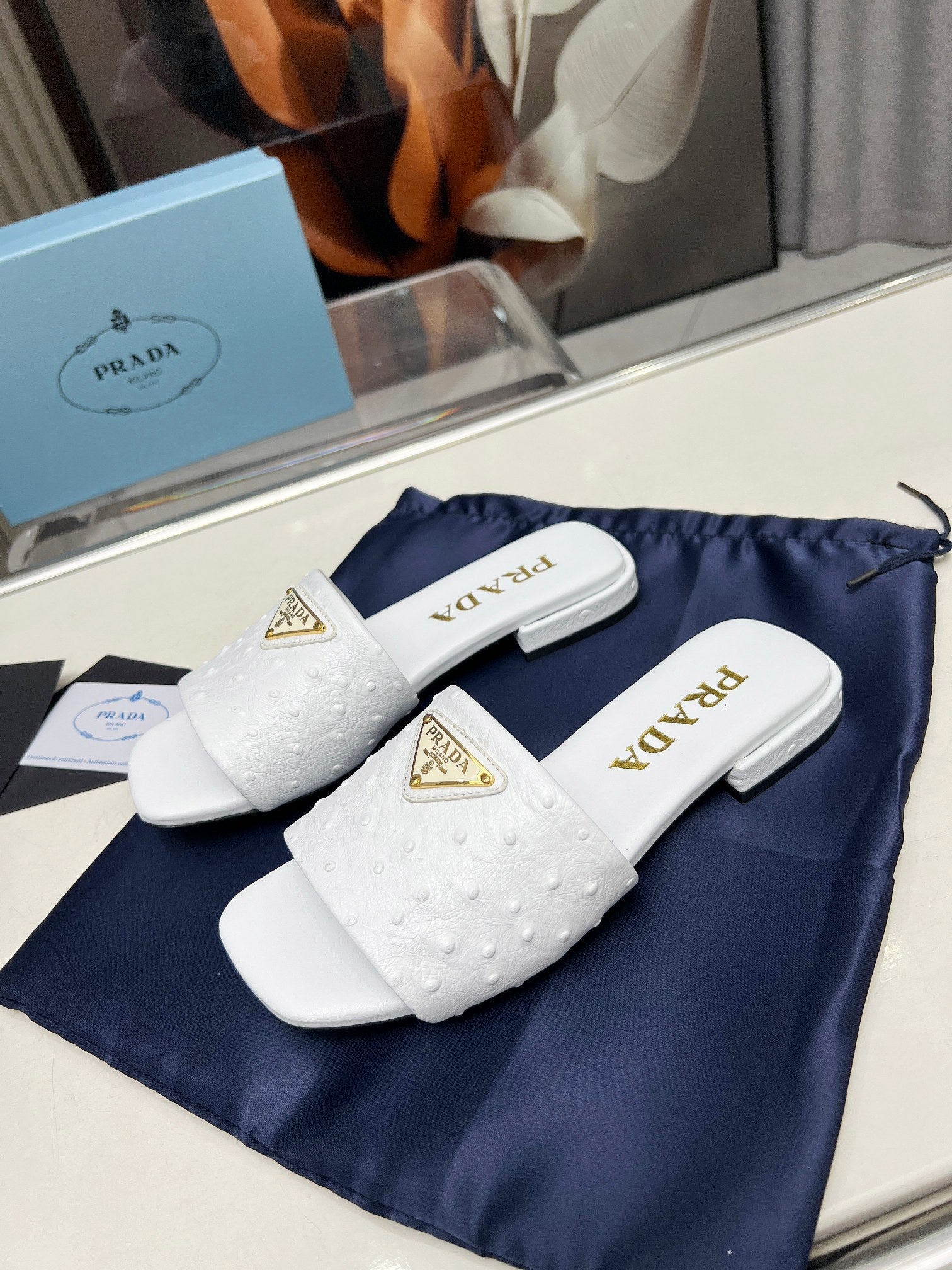 PRADA SAFFIANO PATENT SLIDES OSTRICH MOTIF WHITE CALFSKIN