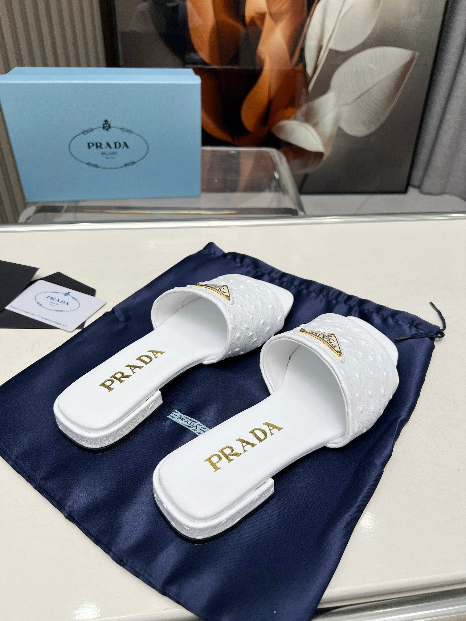 PRADA SAFFIANO PATENT SLIDES OSTRICH MOTIF WHITE CALFSKIN