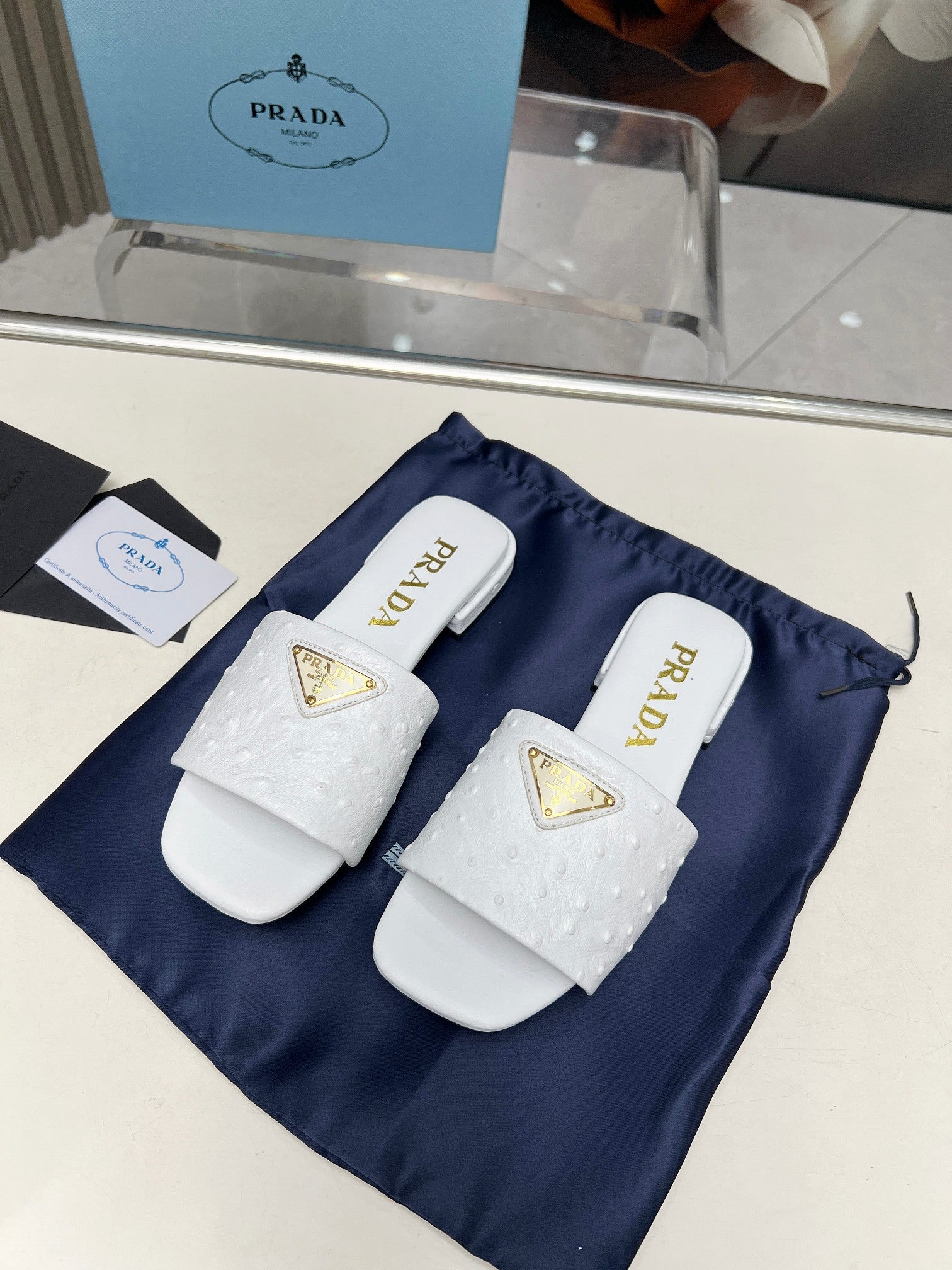 PRADA SAFFIANO PATENT SLIDES OSTRICH MOTIF WHITE CALFSKIN
