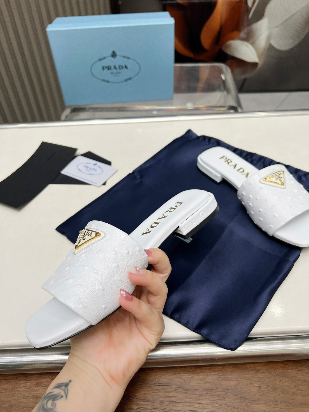 PRADA SAFFIANO PATENT SLIDES OSTRICH MOTIF WHITE CALFSKIN