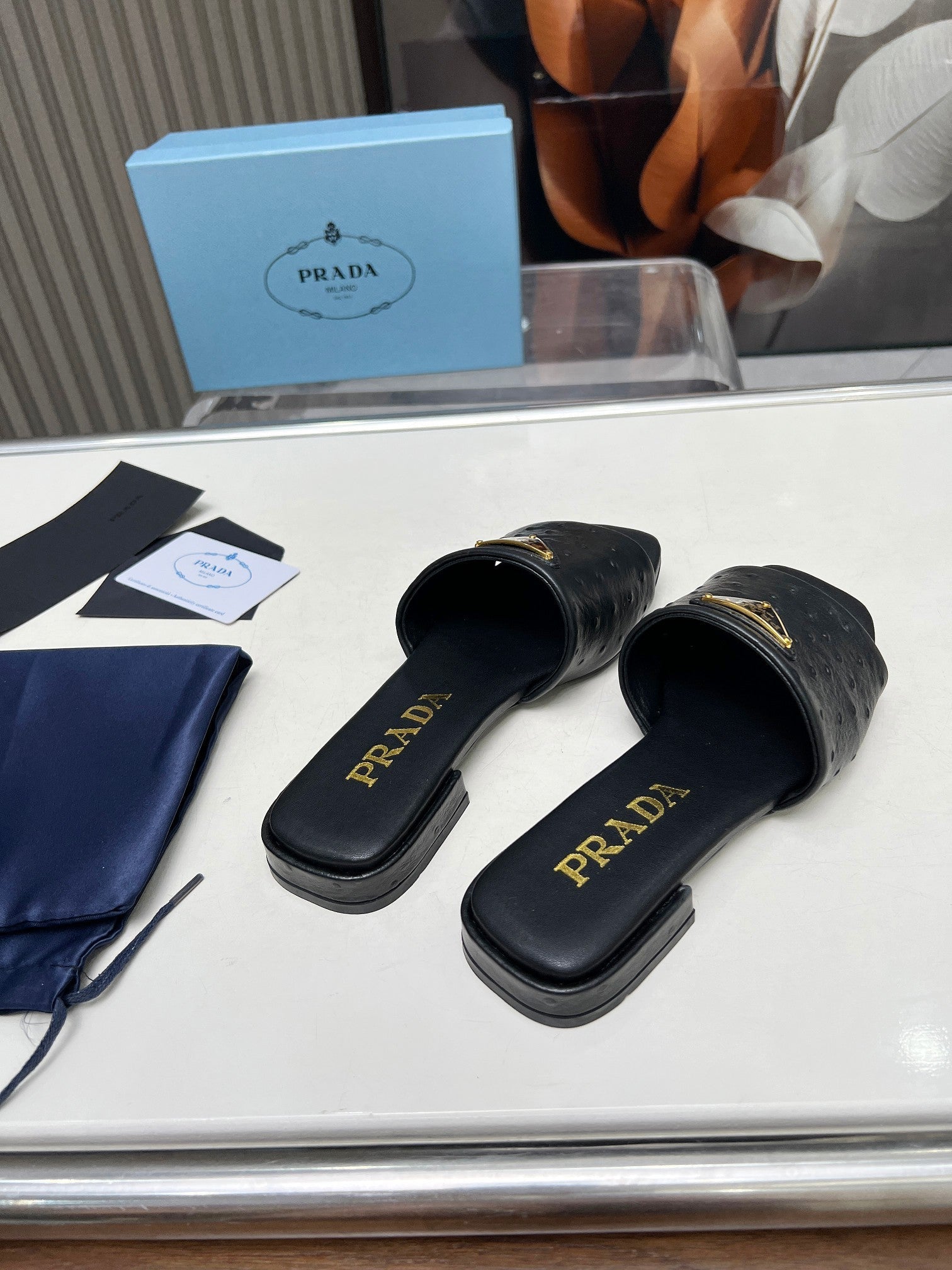 PRADA SAFFIANO PATENT SLIDES OSTRICH MOTIF BLACK CALFSKIN
