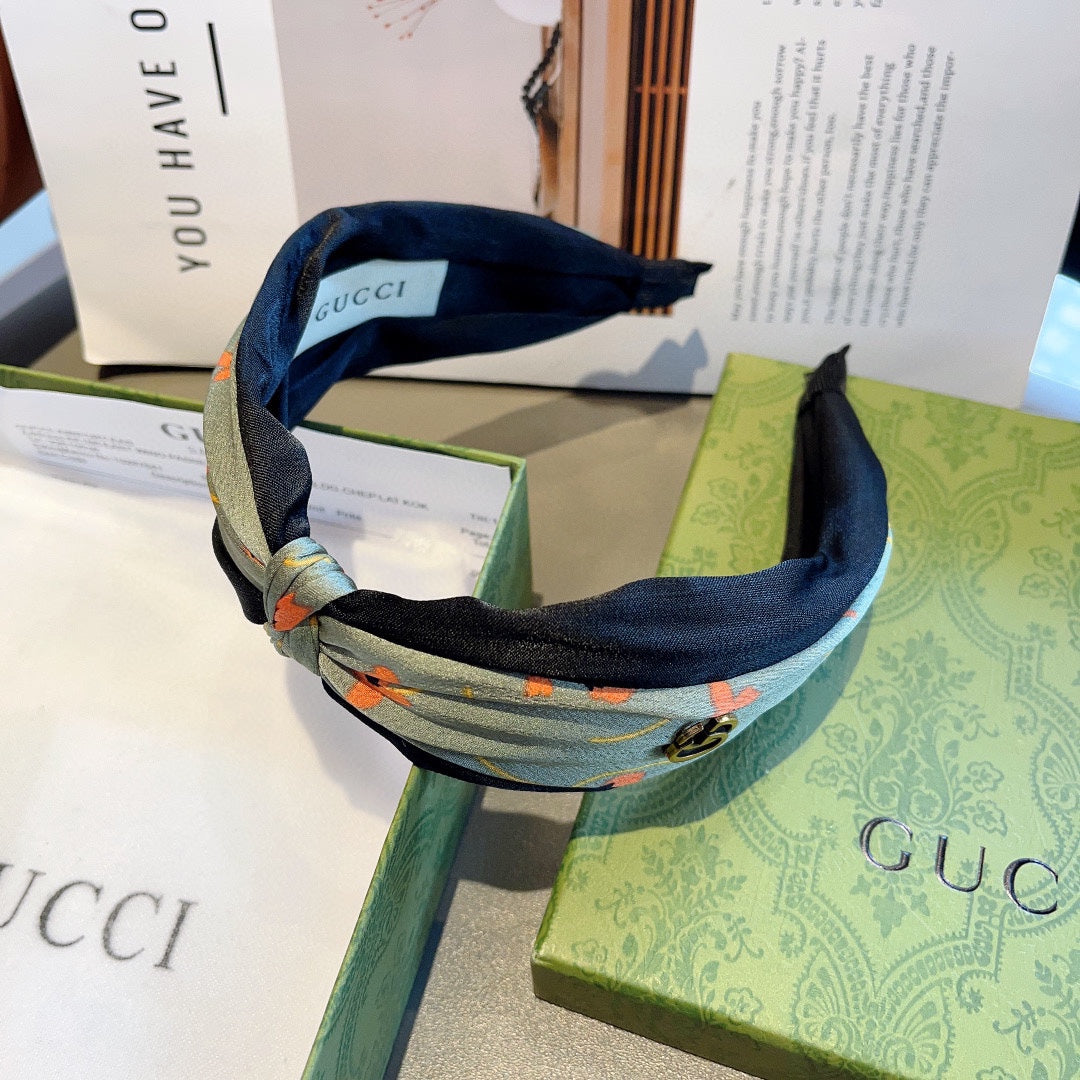 GUCCI HAIRBAND WITH FLOWER PRINT IN MOSS GREEN SILK 398865