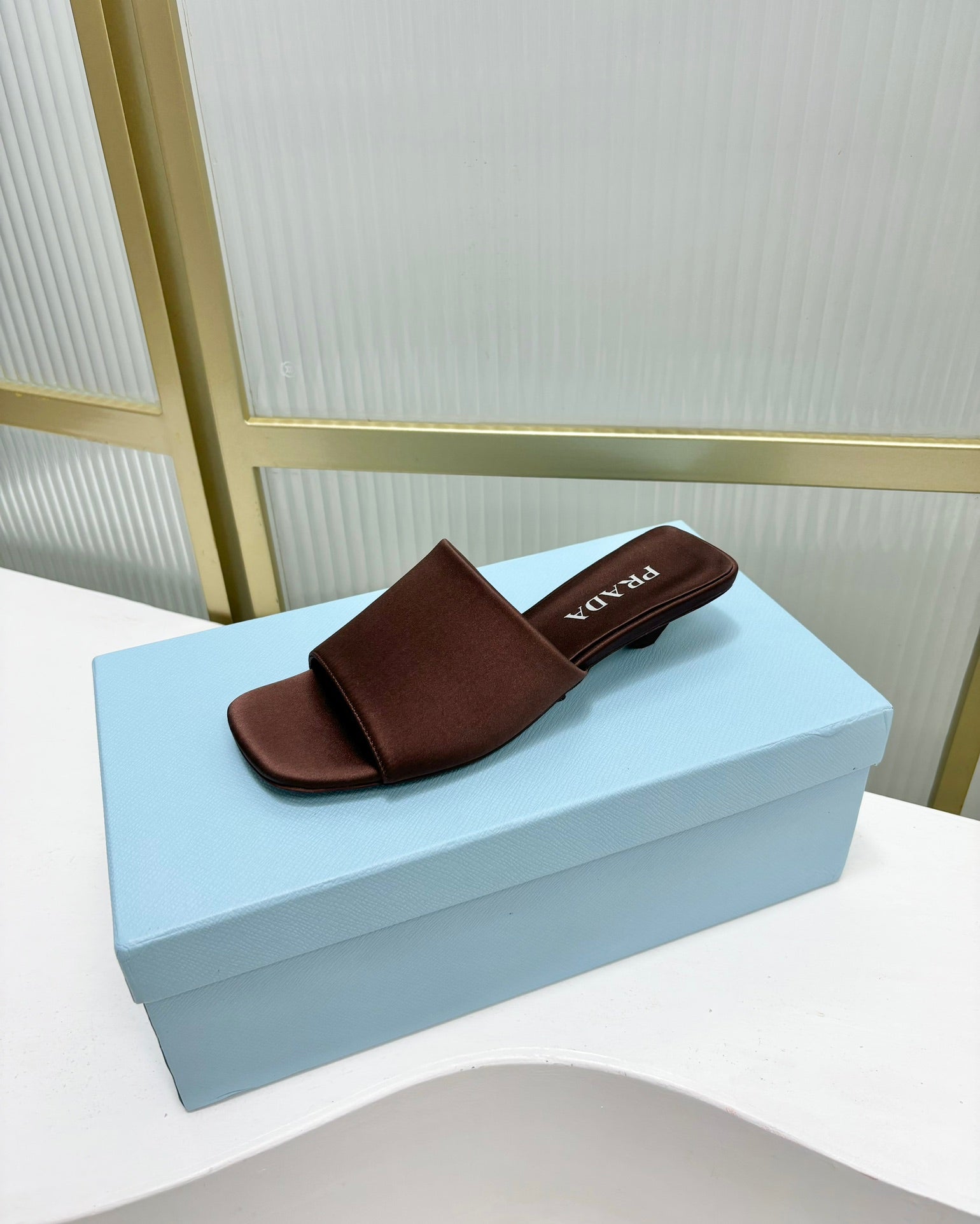 PRADA TRIANGLE HEEL SATIN SLIPPERS BROWN
