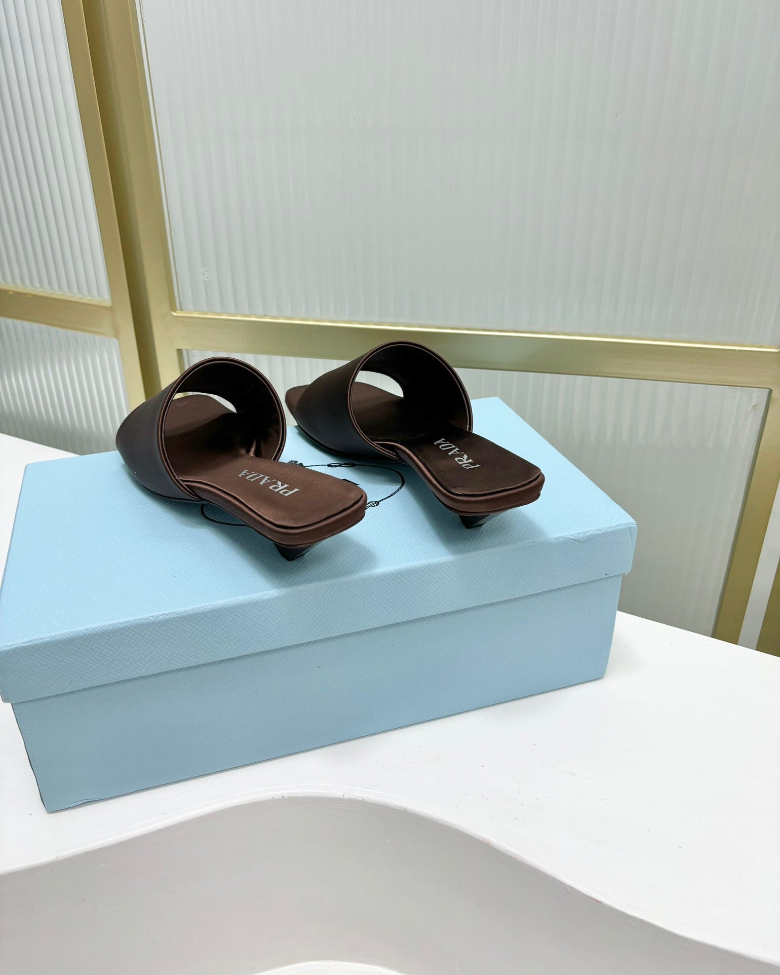 PRADA TRIANGLE HEEL SATIN SLIPPERS BROWN