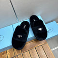 PRADA FLAT MULES IN BLACK RABBIT FUR