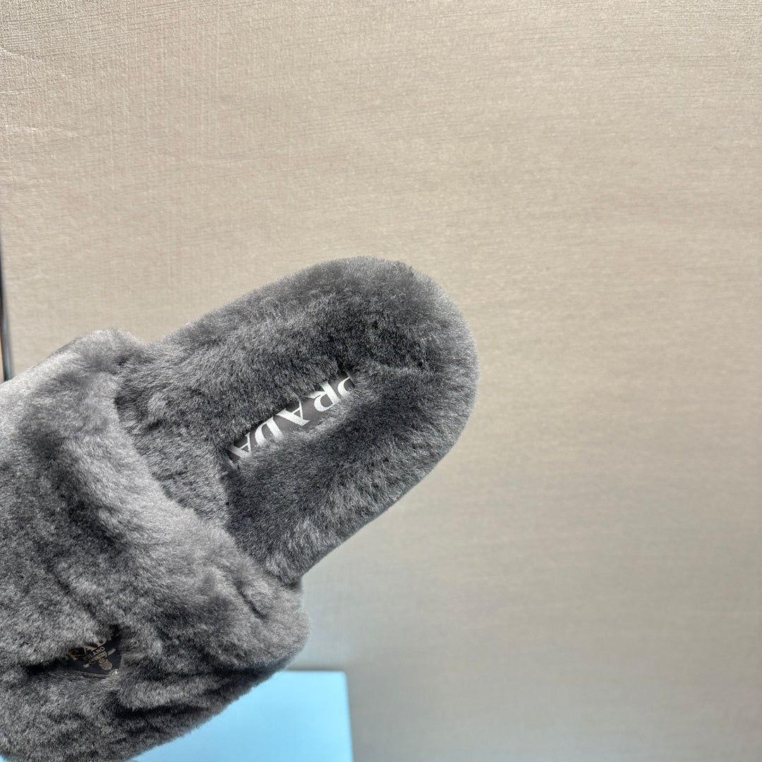 PRADA THICK-SOLED FUR SLIDES GRAY WITH TRIANGLE LOGO