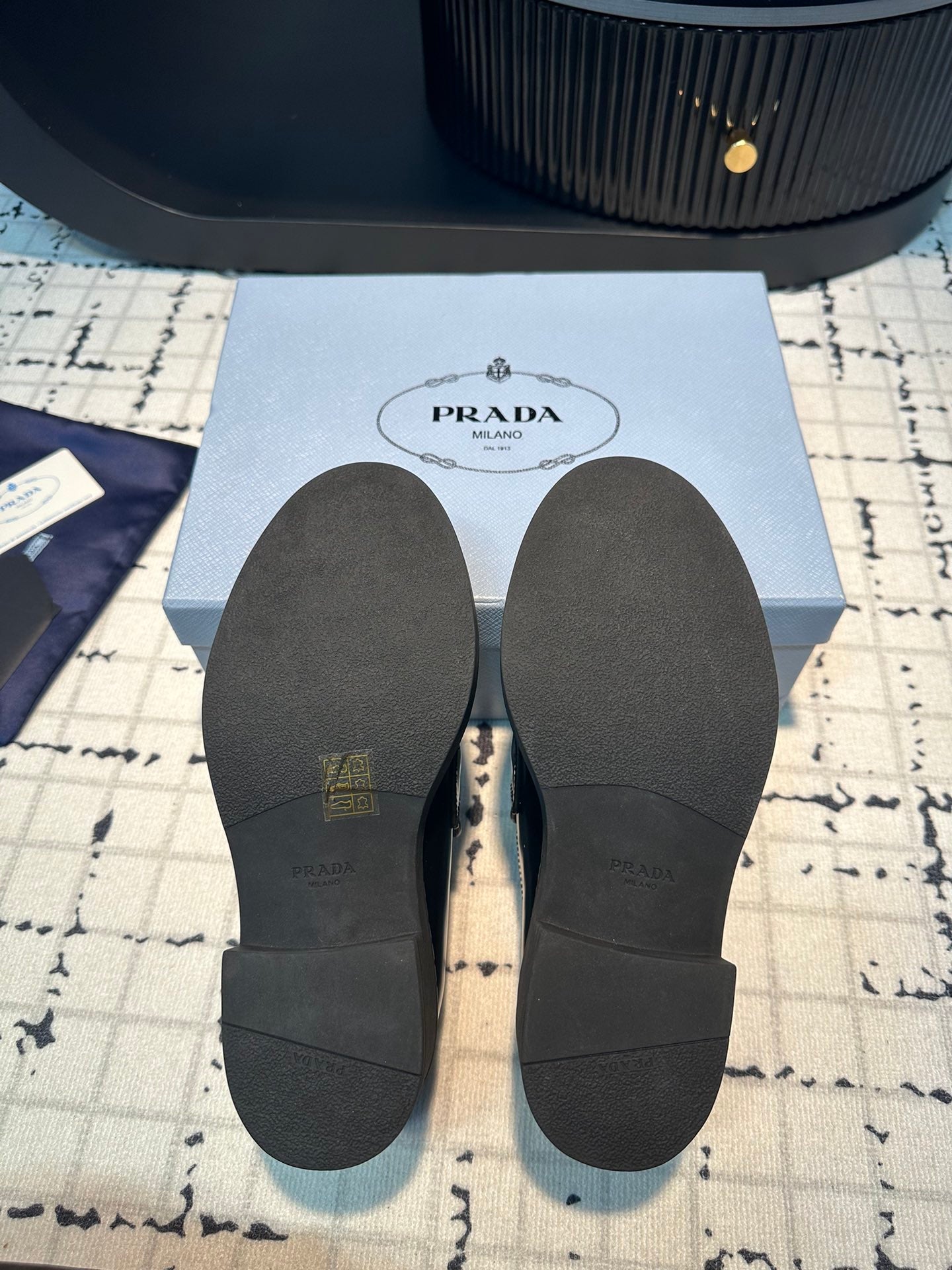 PRADA SCHOCOLATE BRUSHED LOAFERS BLACK AND WHITE BORDER CALFSKIN