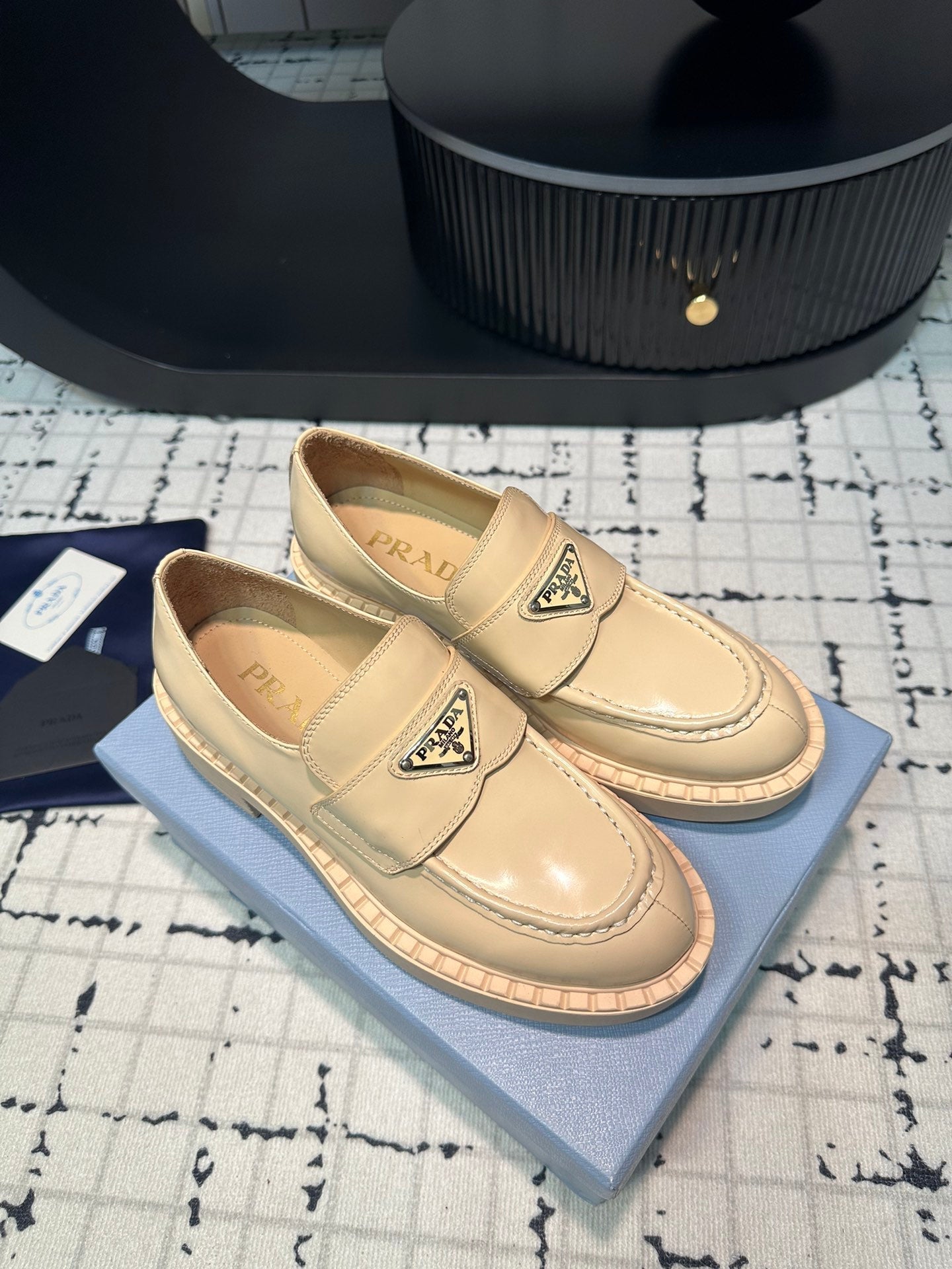 PRADA SCHOCOLATE BRUSHED LOAFERS CREAM CALFSKIN