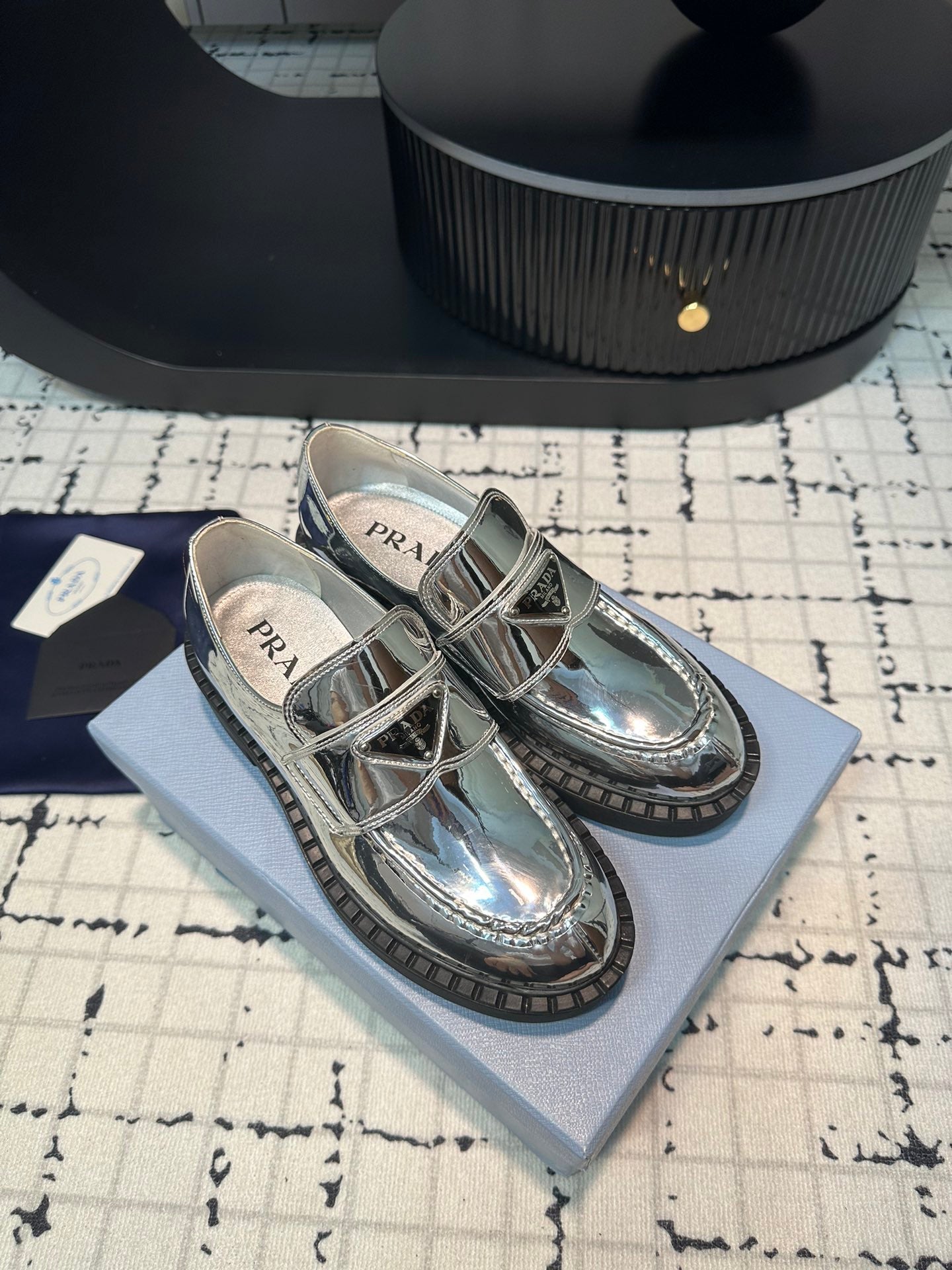 PRADA SCHOCOLATE BRUSHED LOAFERS GLOSSY SILVER CALFSKIN