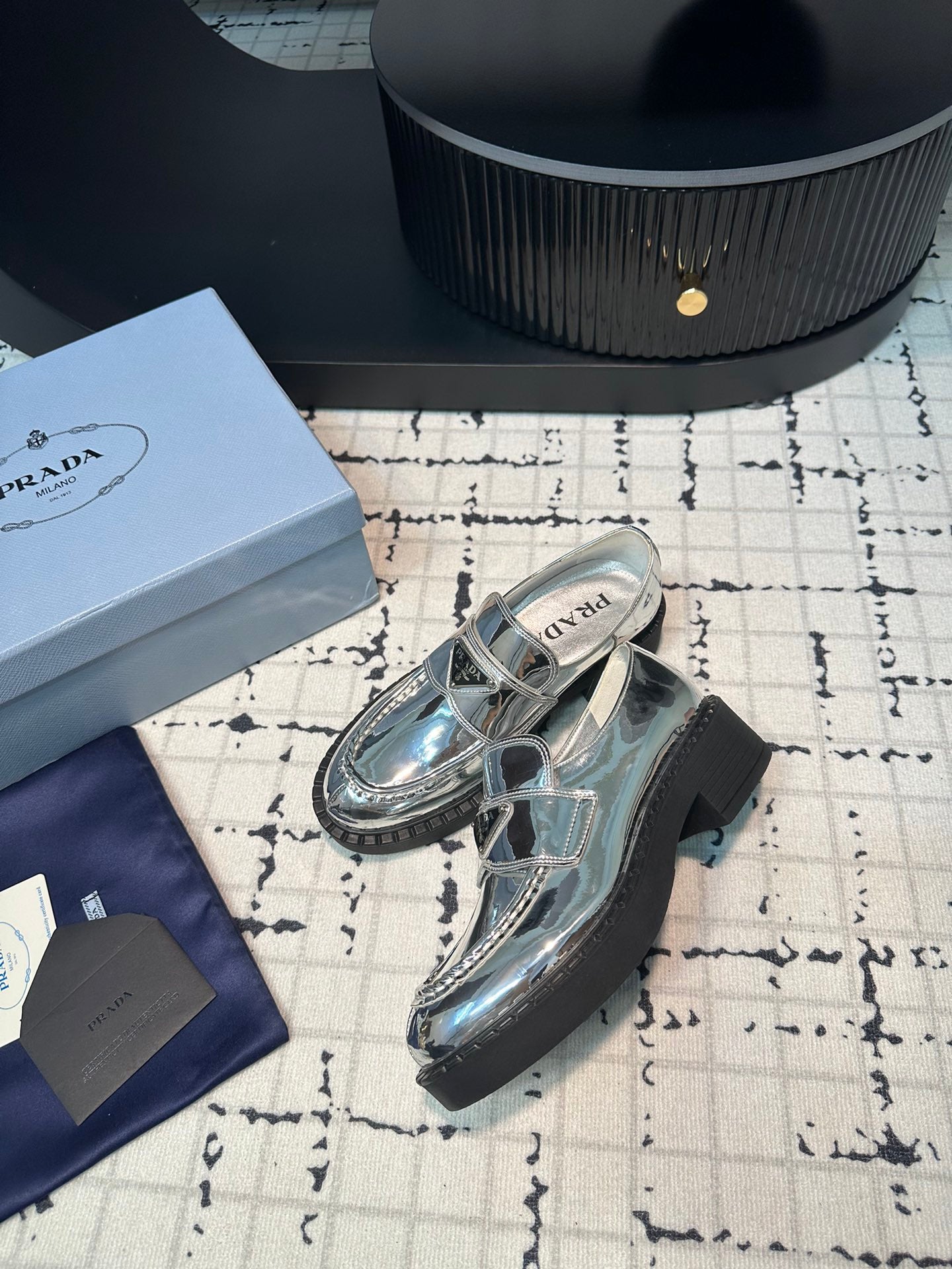 PRADA SCHOCOLATE BRUSHED LOAFERS GLOSSY SILVER CALFSKIN
