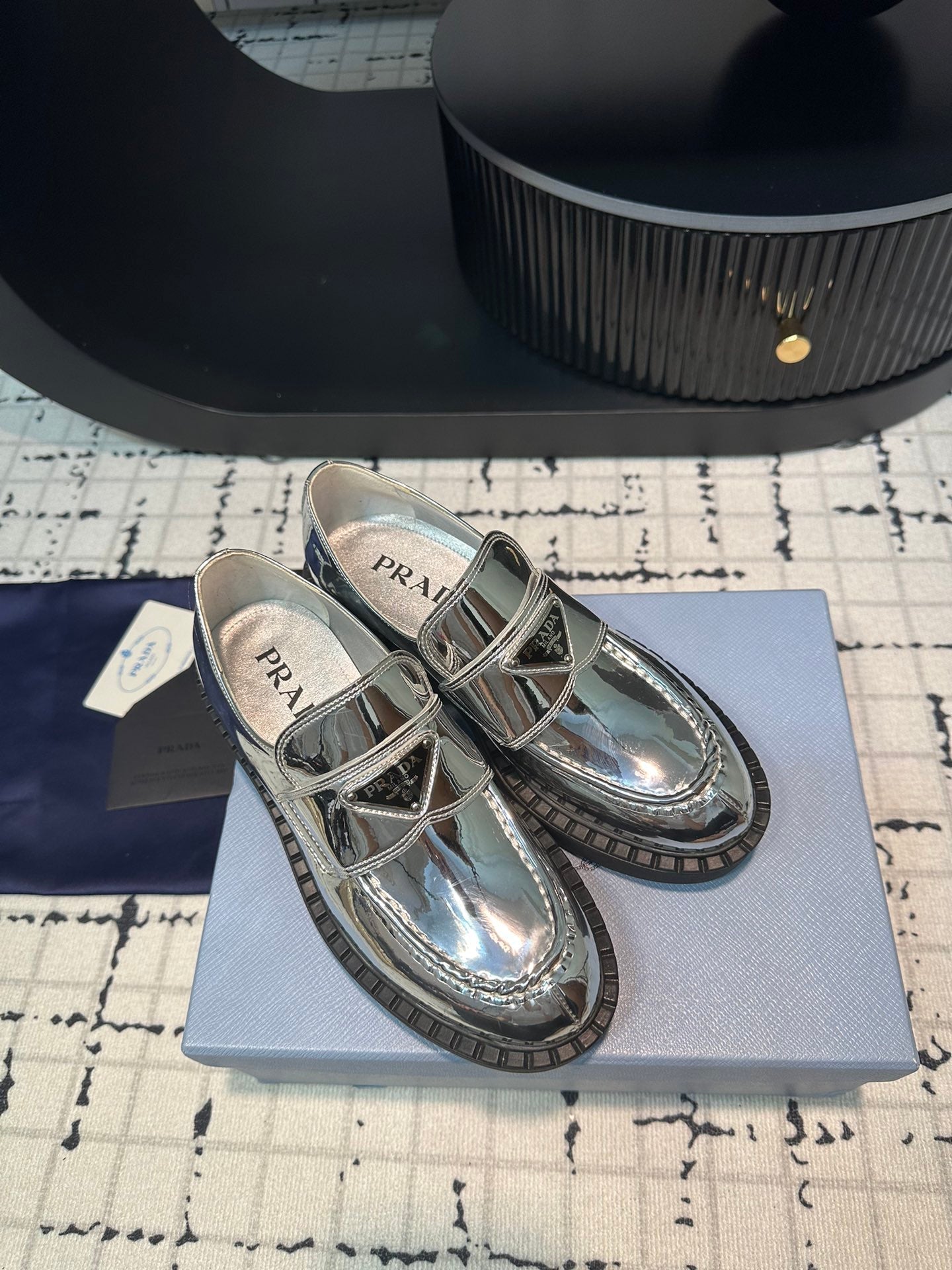 PRADA SCHOCOLATE BRUSHED LOAFERS GLOSSY SILVER CALFSKIN