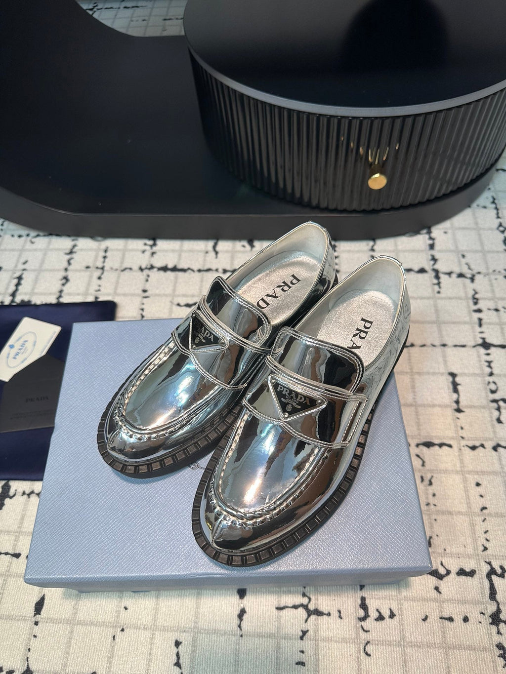 PRADA SCHOCOLATE BRUSHED LOAFERS GLOSSY SILVER CALFSKIN