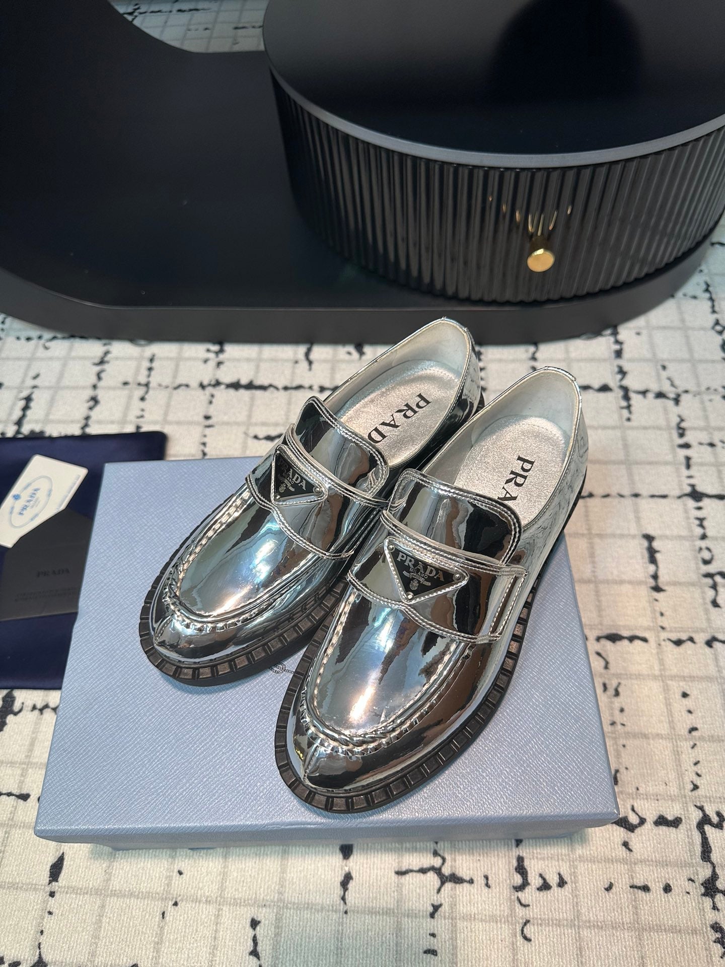 PRADA SCHOCOLATE BRUSHED LOAFERS GLOSSY SILVER CALFSKIN