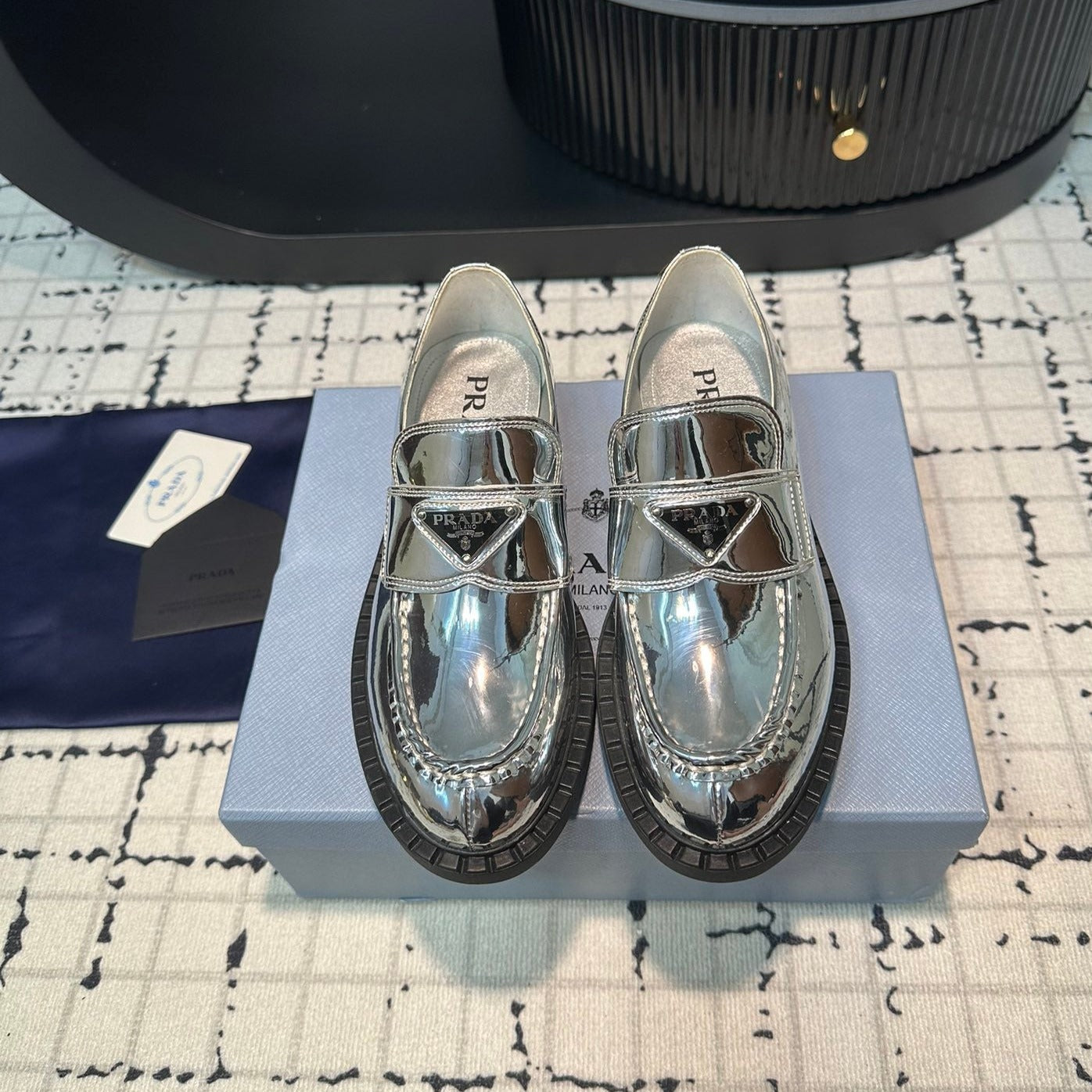 PRADA SCHOCOLATE BRUSHED LOAFERS GLOSSY SILVER CALFSKIN