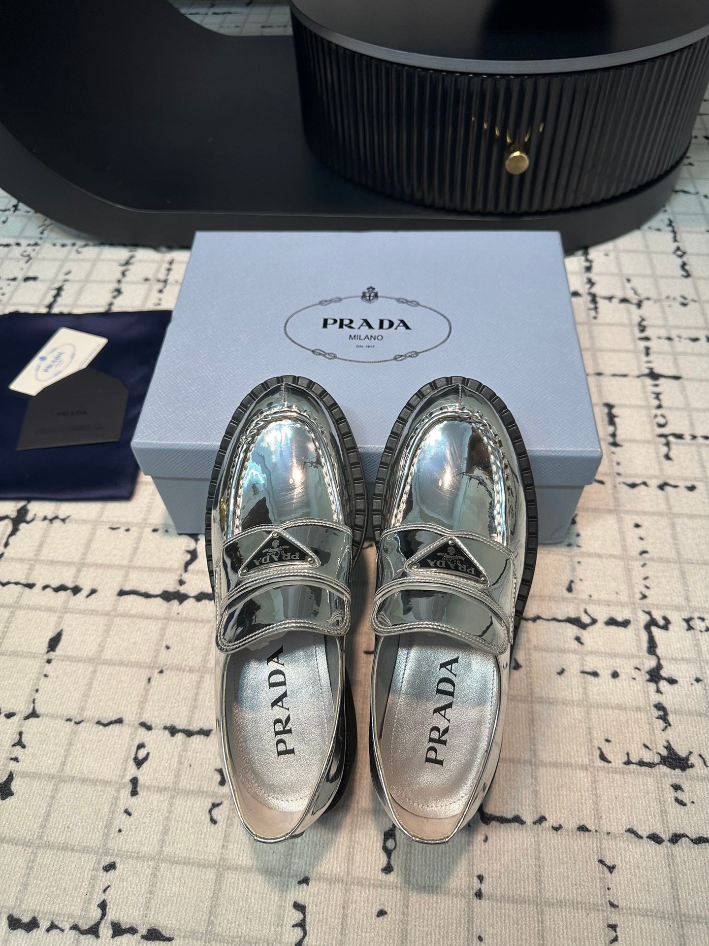 PRADA SCHOCOLATE BRUSHED LOAFERS GLOSSY SILVER CALFSKIN