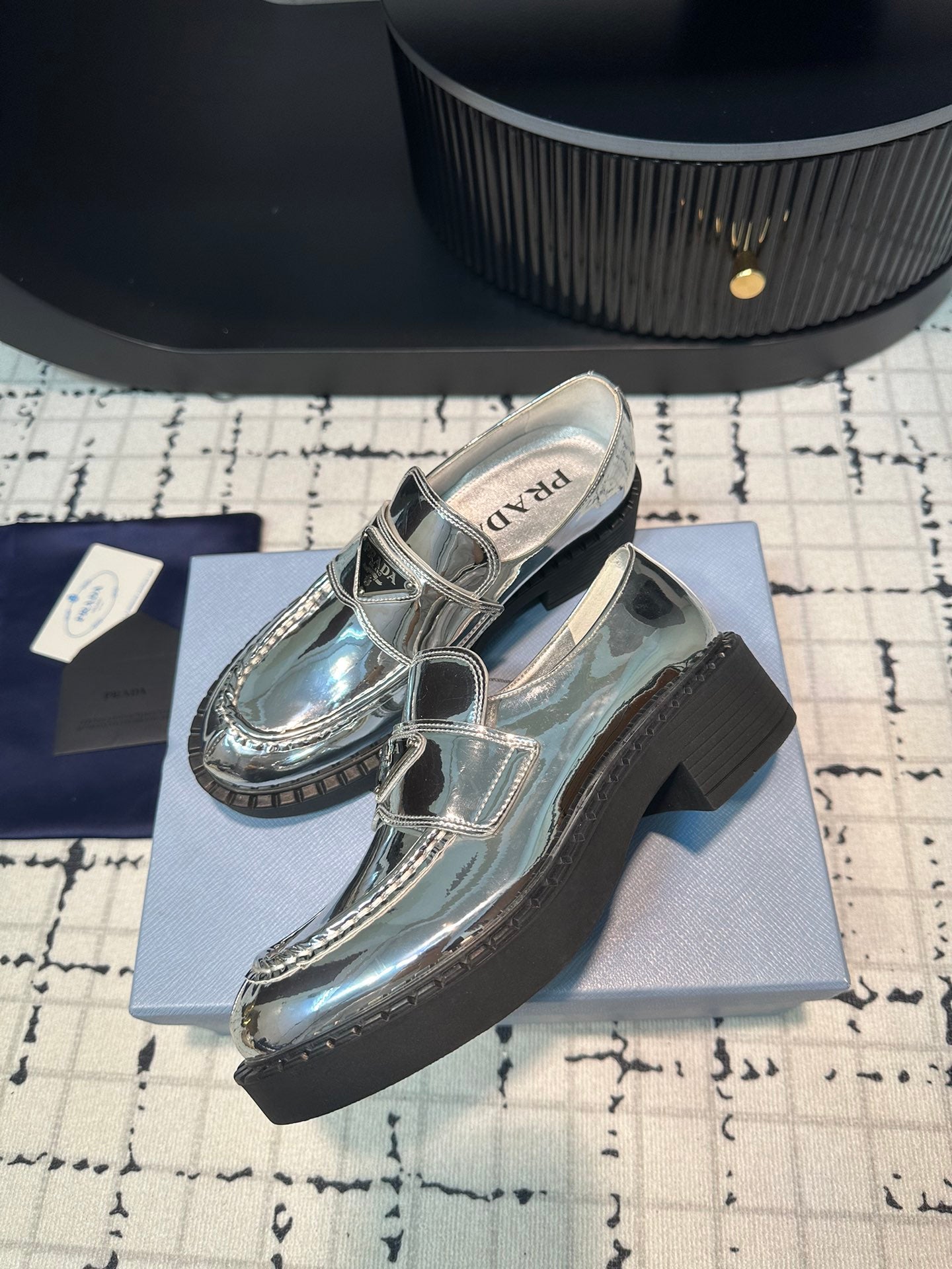 PRADA SCHOCOLATE BRUSHED LOAFERS GLOSSY SILVER CALFSKIN