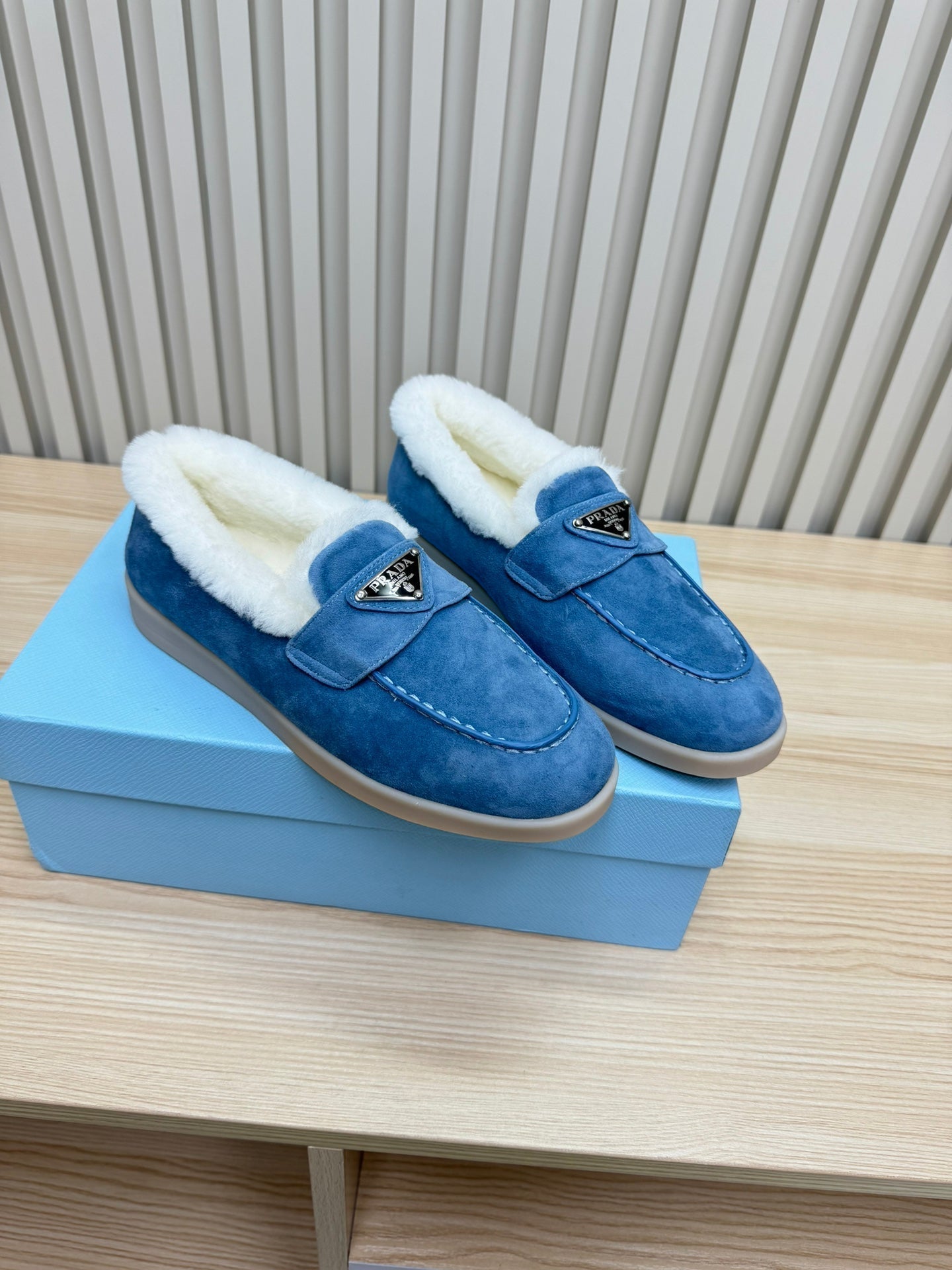 PRADA LOAFER IN AZURE BLUE SUEDE AND FUR LINING ATTACHED TRIANGLE LOGO