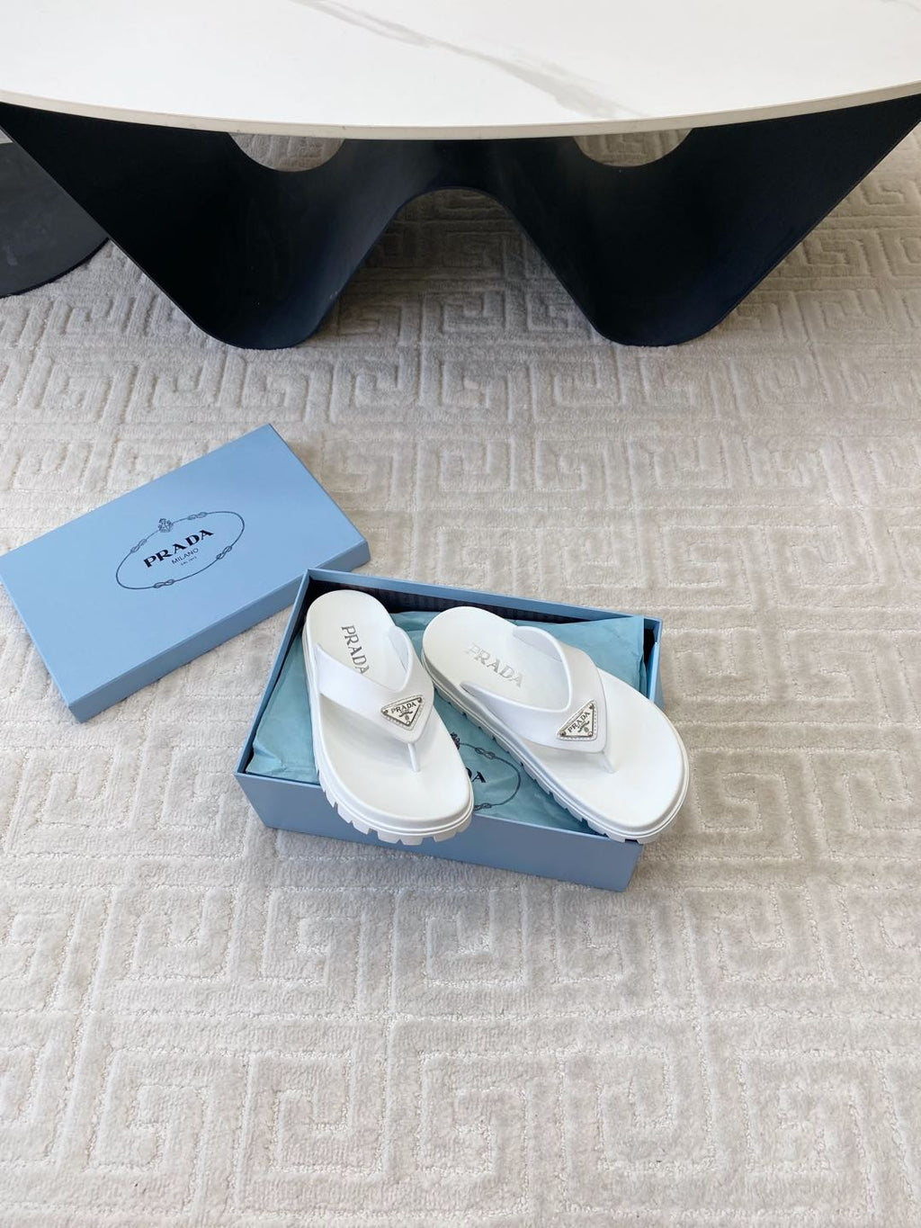 PRADA THICK-SOLED FLIP FLOPS IN WHITE RUBBER