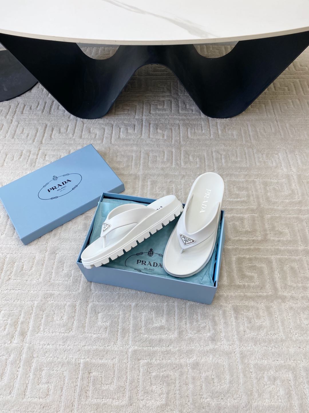 PRADA THICK-SOLED FLIP FLOPS IN WHITE RUBBER