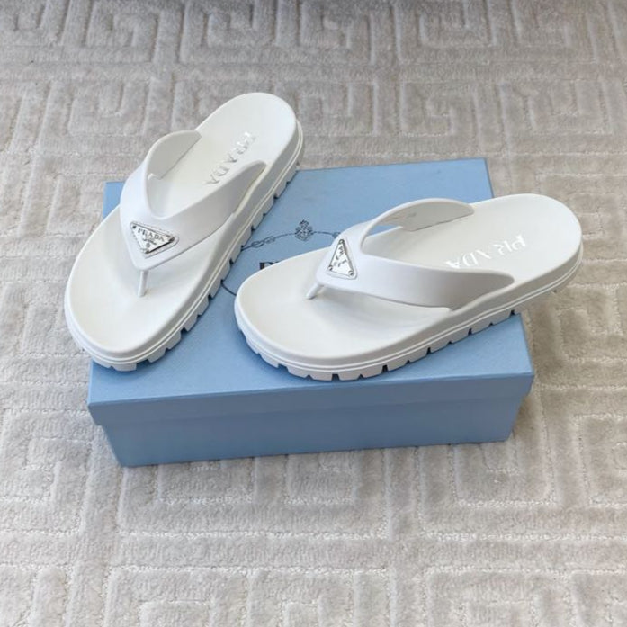 PRADA THICK-SOLED FLIP FLOPS IN WHITE RUBBER